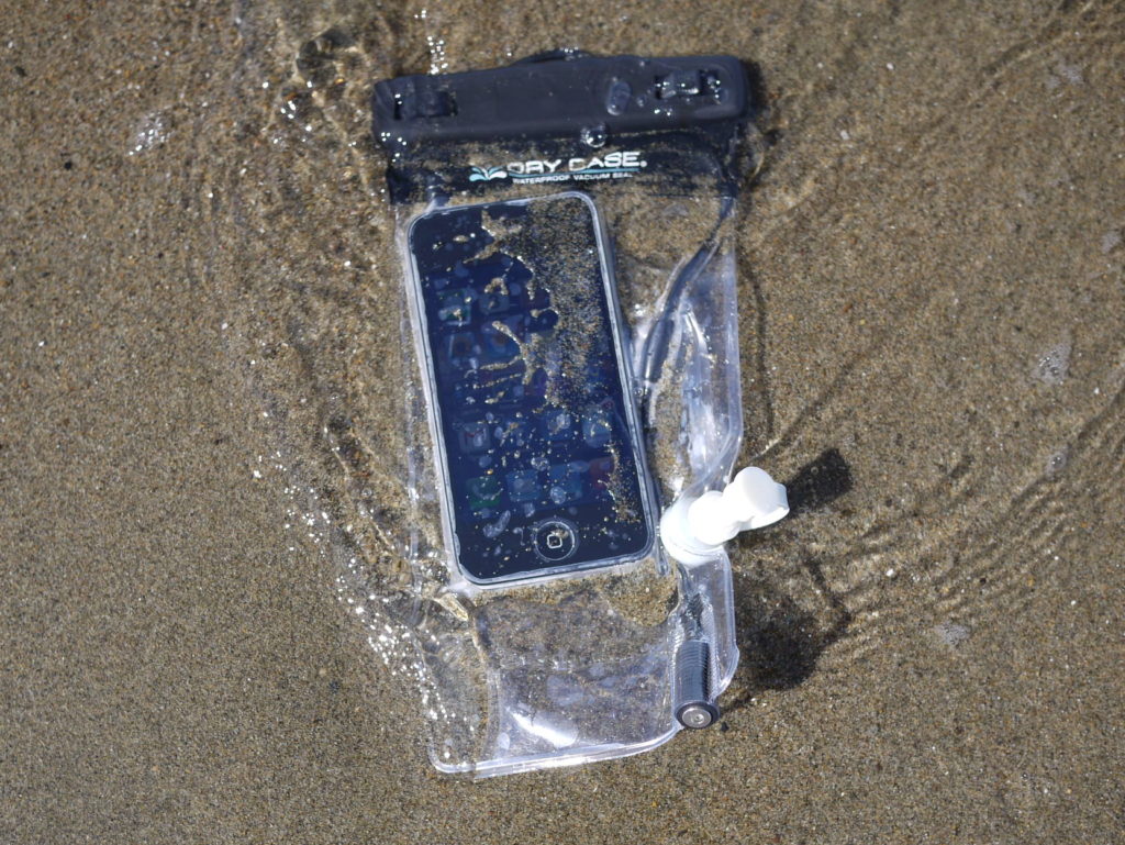Iphone submerged in ocean water and sand in Calabria. Protected by waterproof case. 