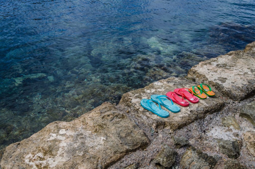 Havaianas flip flops on the beach in Calabria